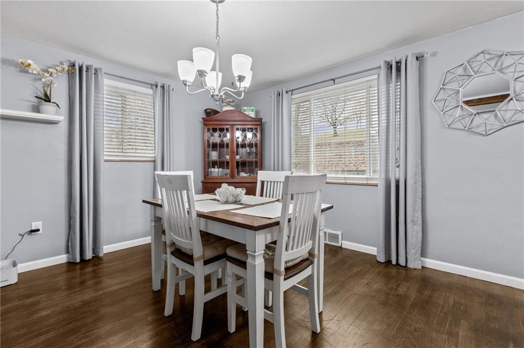 1488 Anderson Road Pittsburgh, PA 15209 - Photo 8 of 18 a view of a dining room with furniture wooden floor and chandelier