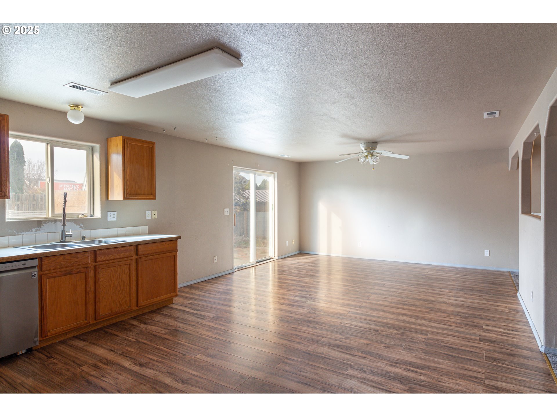 2464 Blue Jay Way Umatilla, OR 97882 - Photo 21 of 39 a view of an empty room with window and wooden floor