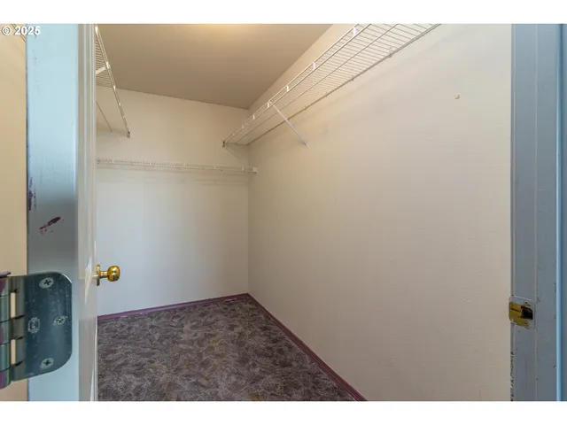 a bathroom with a tub sink vanity and mirror