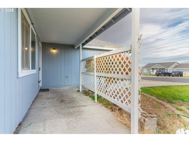 a kitchen with a sink cabinets and wooden floor