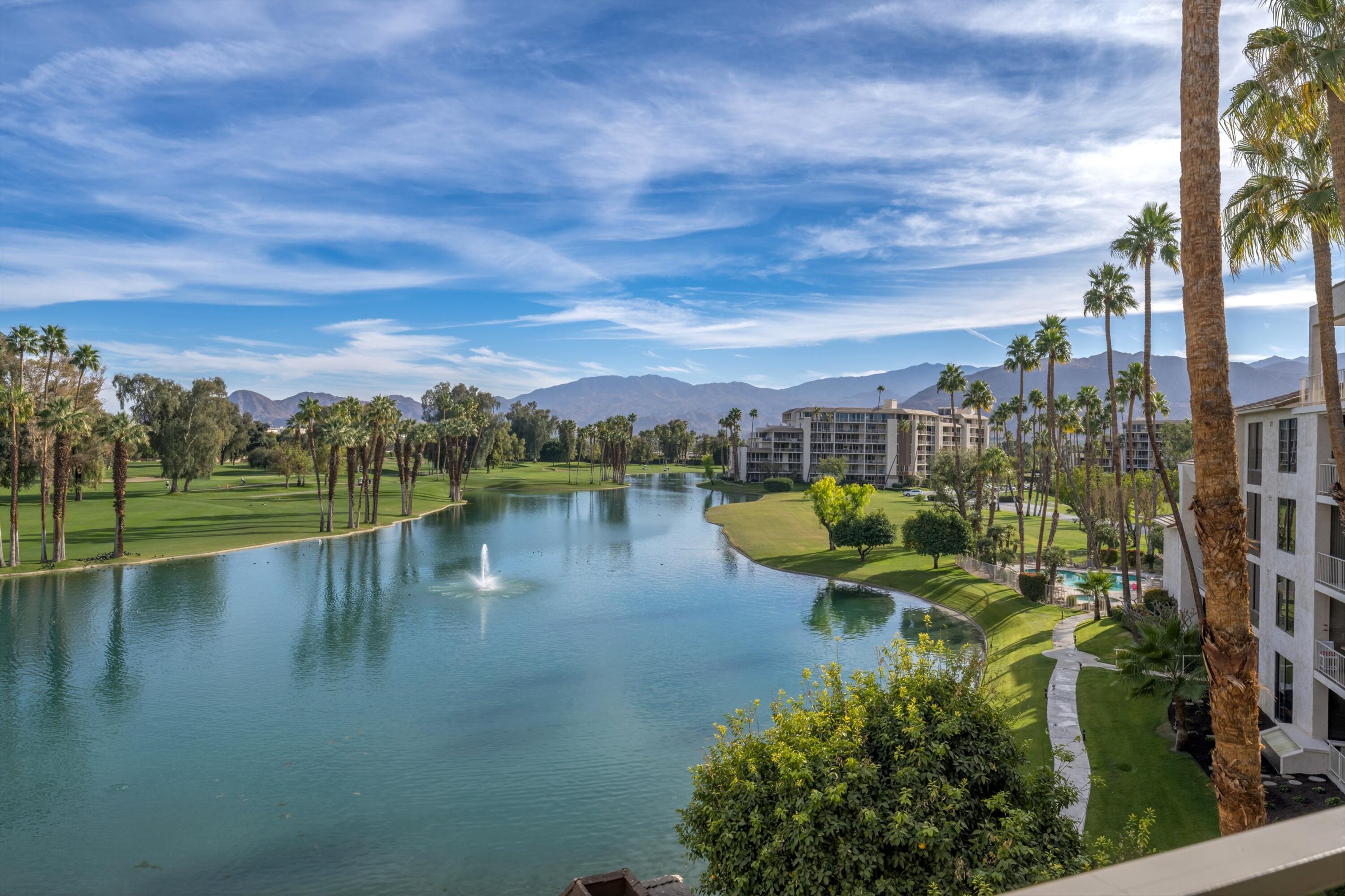 910 Island Drive, Unit 405 Rancho Mirage, CA 92270 - Photo 1 of 33 a view of a lake with a city