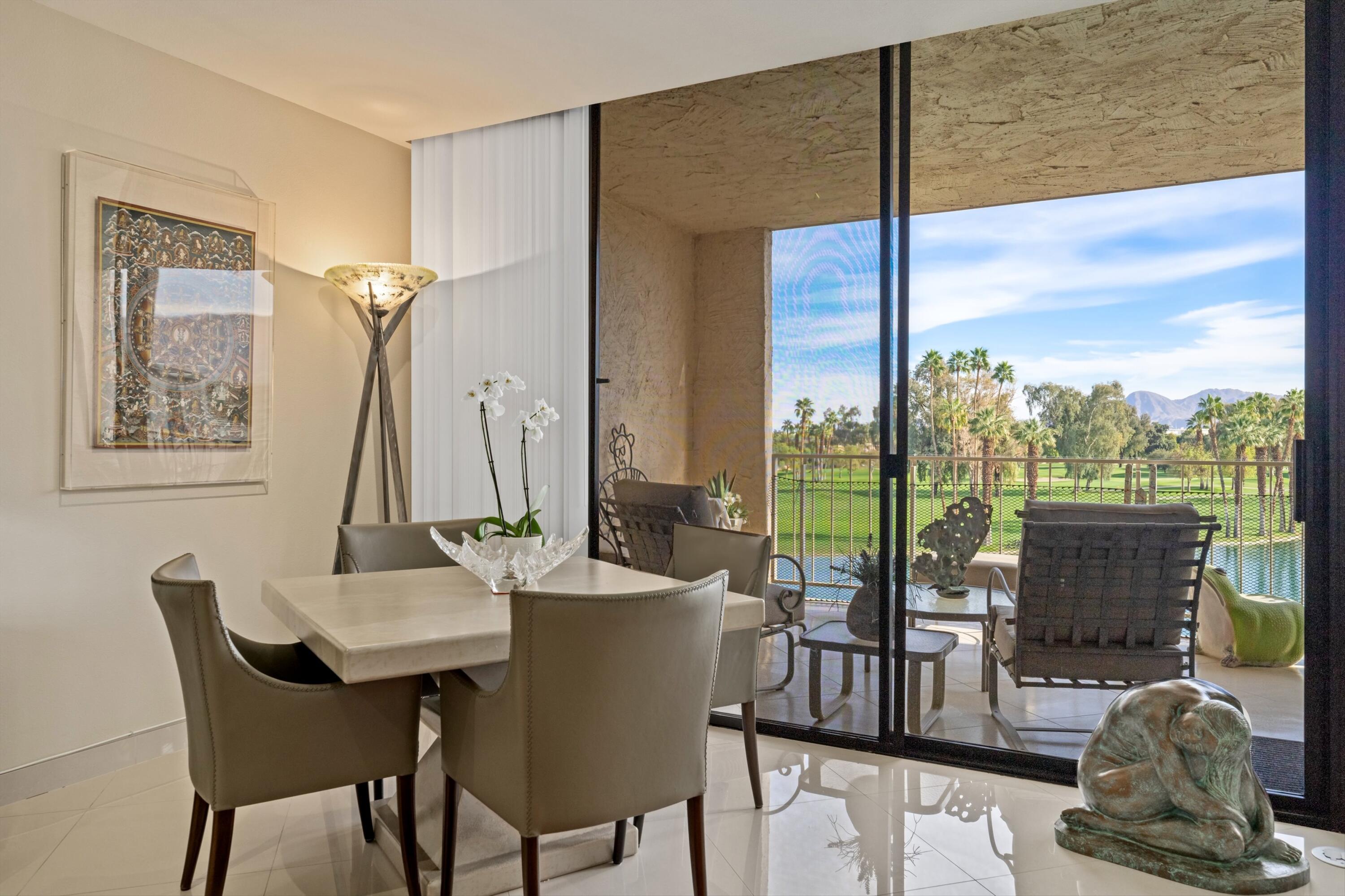 910 Island Drive, Unit 405 Rancho Mirage, CA 92270 - Photo 12 of 33 a view of a dining room with furniture window and outside view