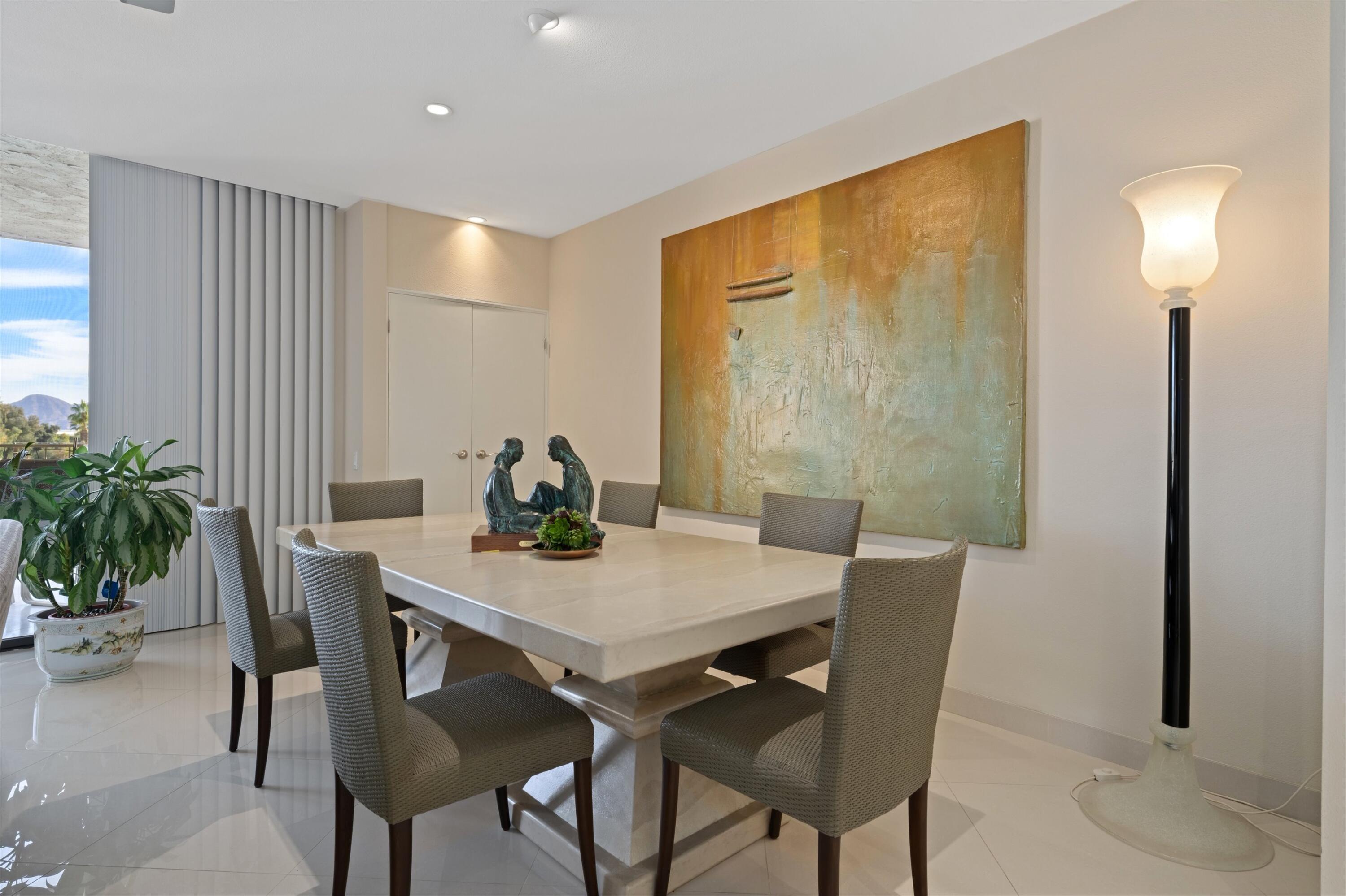 910 Island Drive, Unit 405 Rancho Mirage, CA 92270 - Photo 17 of 33 a view of a dining room with furniture and window