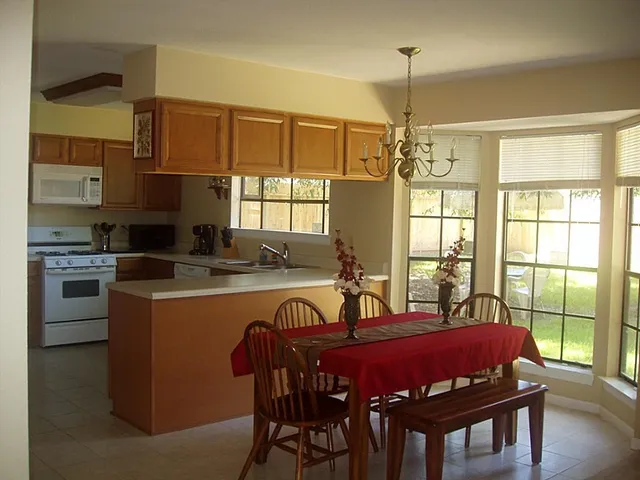 a view of a dining room with furniture window and outside view