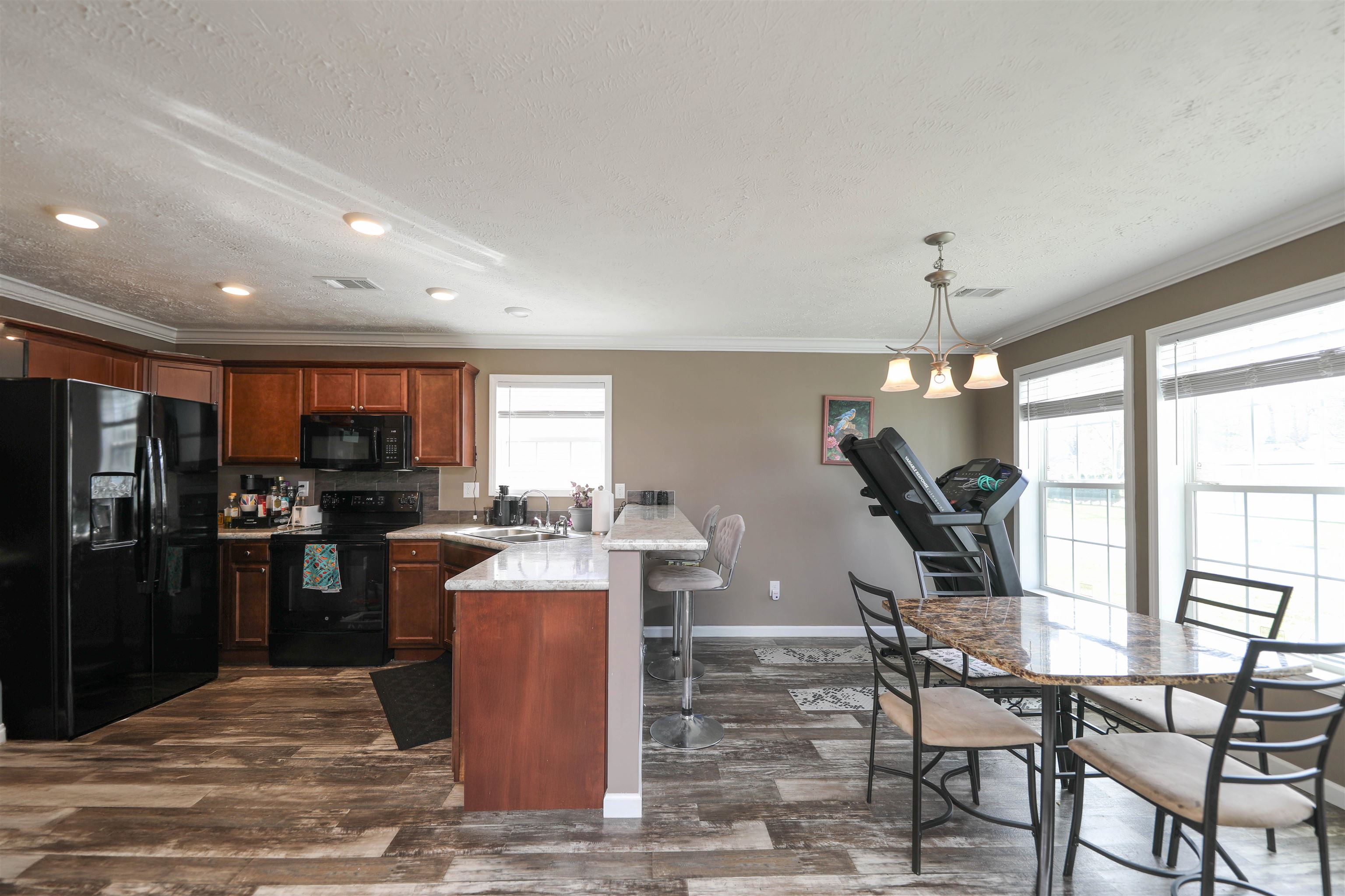 1601 A Street Waynesboro, VA 22980 - Photo 12 of 30 a kitchen with stainless steel appliances kitchen island granite countertop a refrigerator and a stove top oven