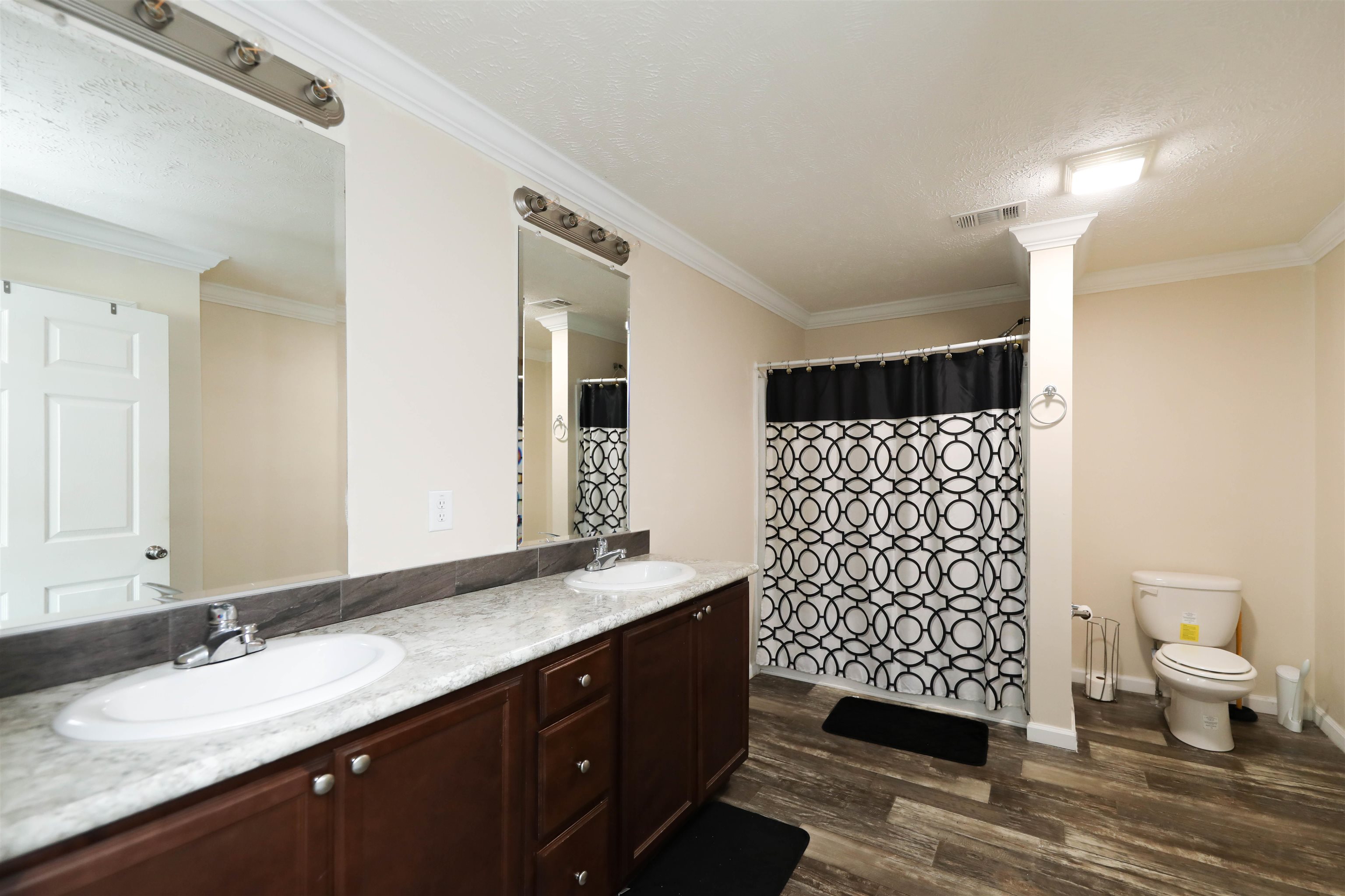1601 A Street Waynesboro, VA 22980 - Photo 16 of 30 a bathroom with a double vanity sink toilet and shower