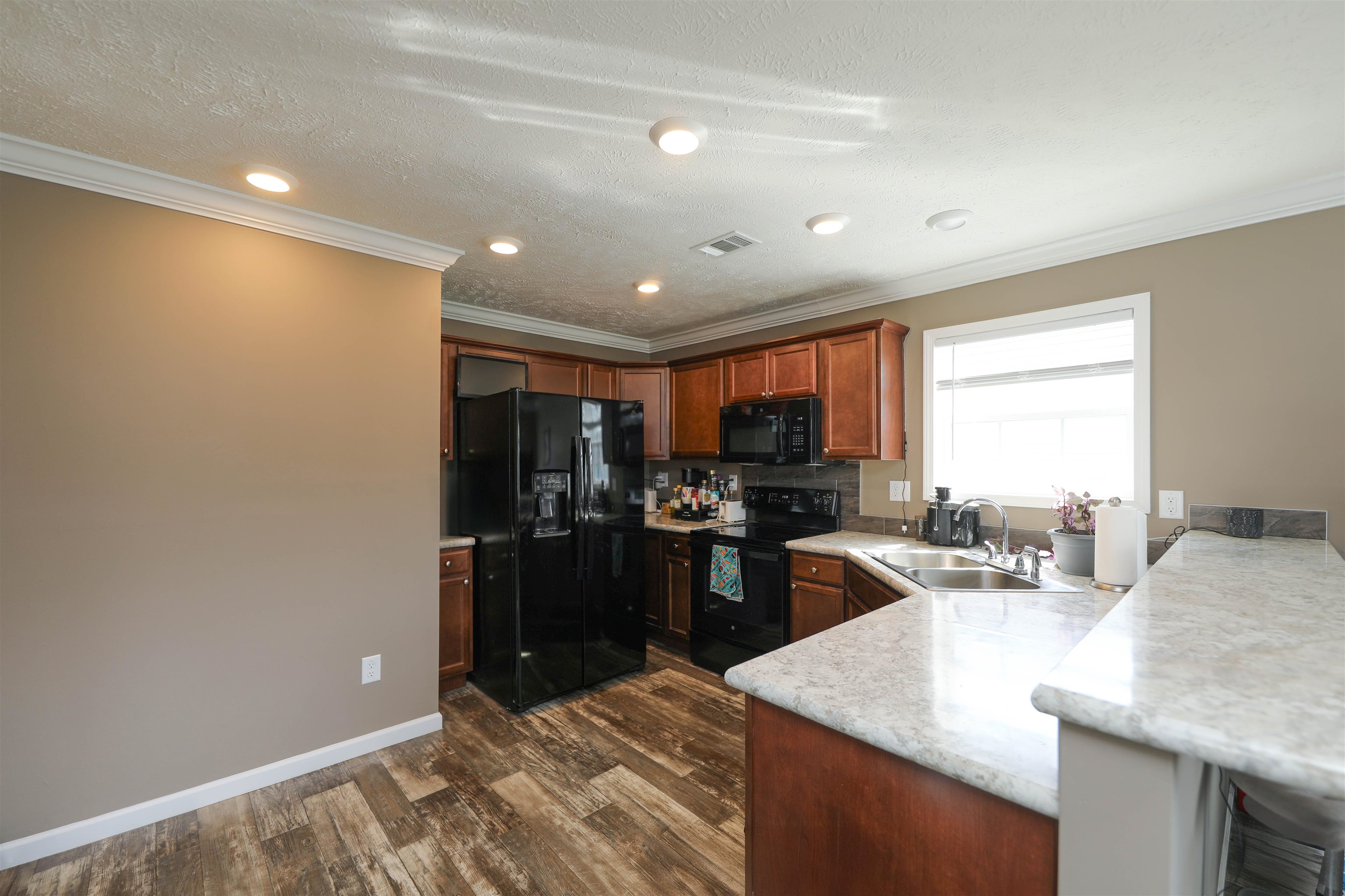 1601 A Street Waynesboro, VA 22980 - Photo 8 of 30 a kitchen with stainless steel appliances granite countertop a sink stove and refrigerator
