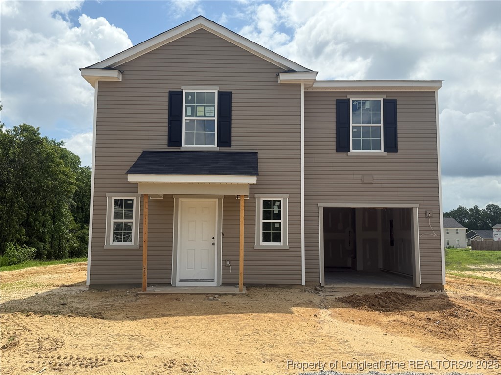 2651 Old Garnet Way Hope Mills, NC 28348 - Photo 1 of 2 a house that has a window in front of it