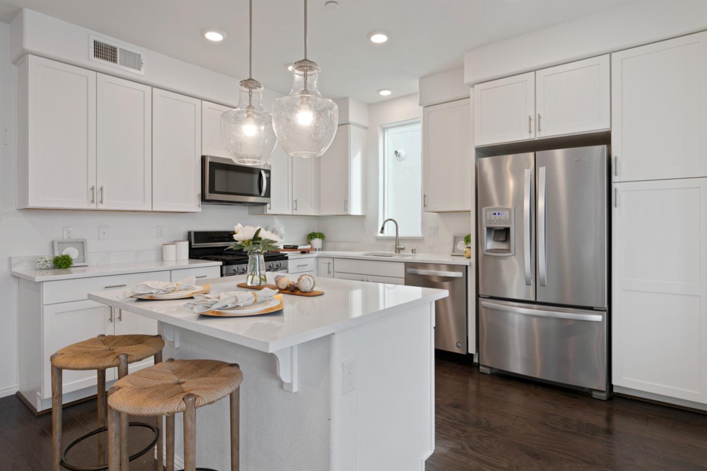 1435 Nightshade Road, Unit 30 Milpitas, CA 95035 - Photo 3 of 16 a kitchen with a sink stainless steel appliances and refrigerator