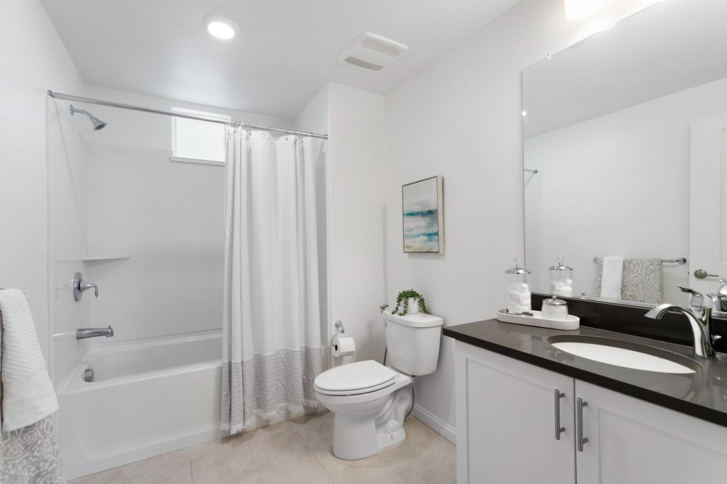 1435 Nightshade Road, Unit 30 Milpitas, CA 95035 - Photo 10 of 16 a bathroom with a granite countertop sink a toilet and shower