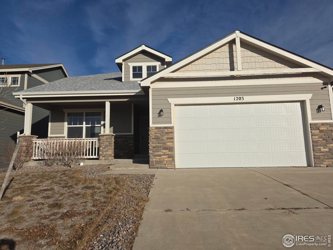 1203 Bison Way Wiggins, CO 80654 - Photo 1 of 17 a front view of a house