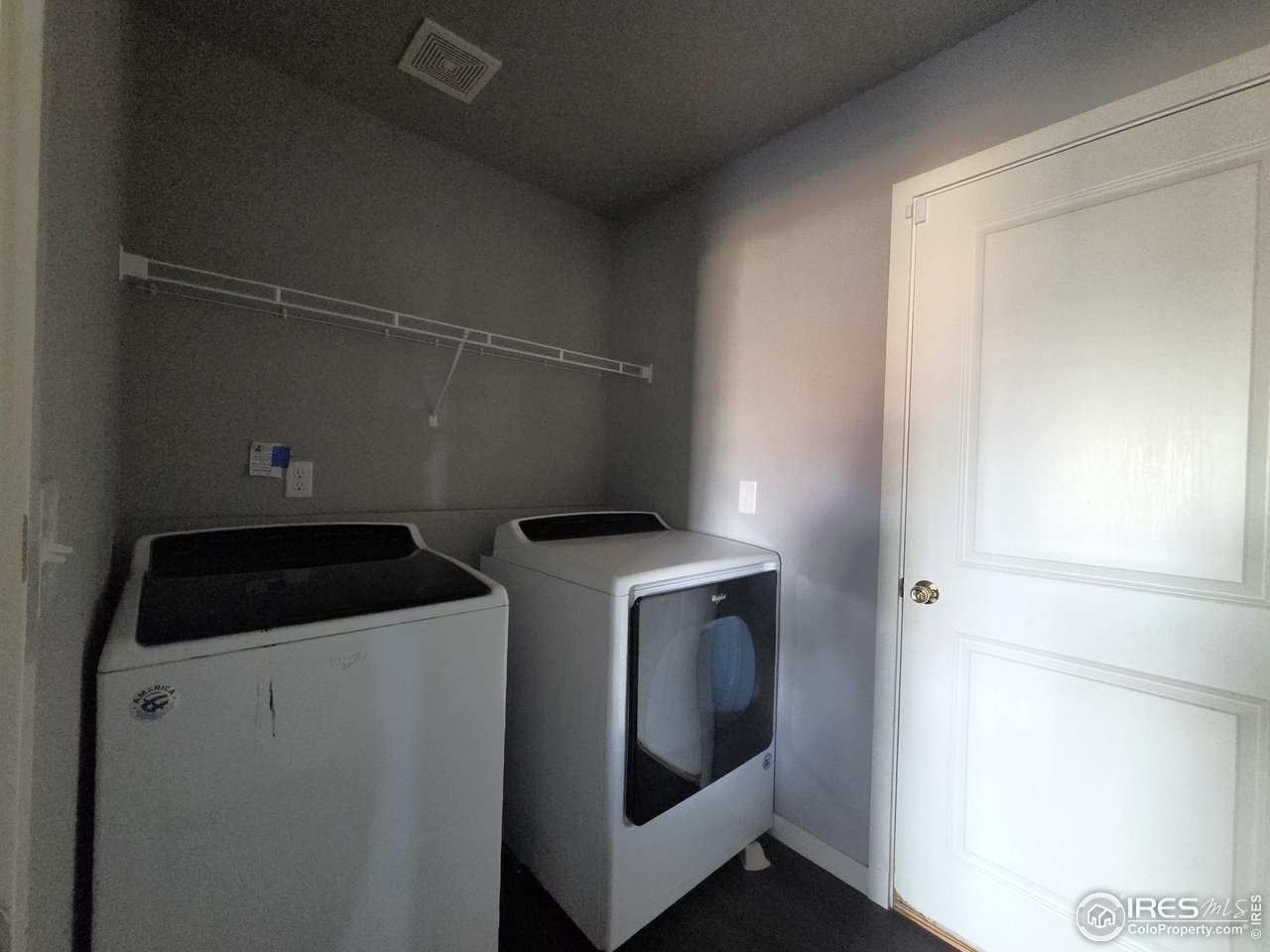1203 Bison Way Wiggins, CO 80654 - Photo 12 of 17 a utility room with dryer and washer