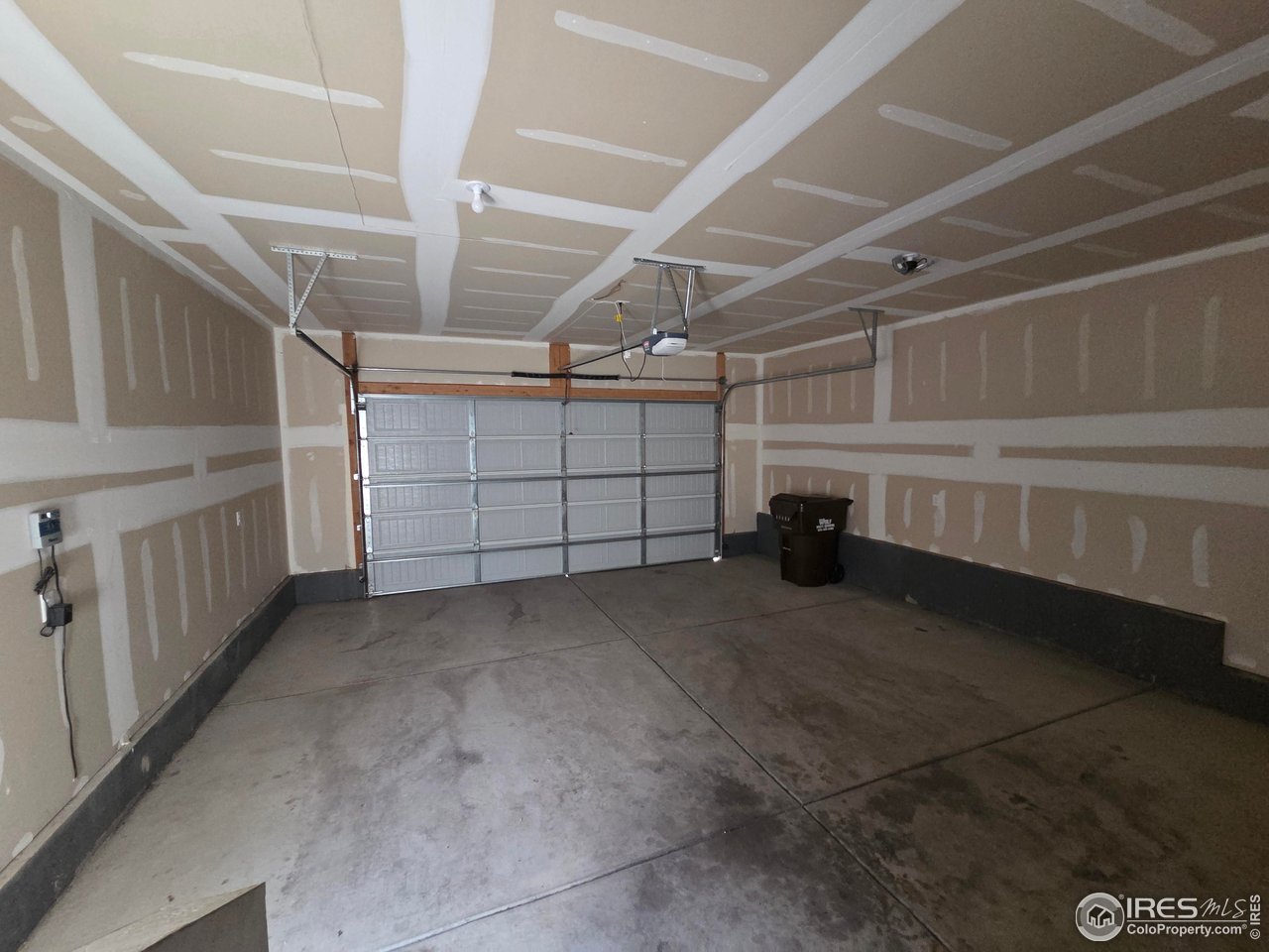 1203 Bison Way Wiggins, CO 80654 - Photo 16 of 17 a view of a garage room
