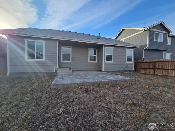 a view of house with a yard