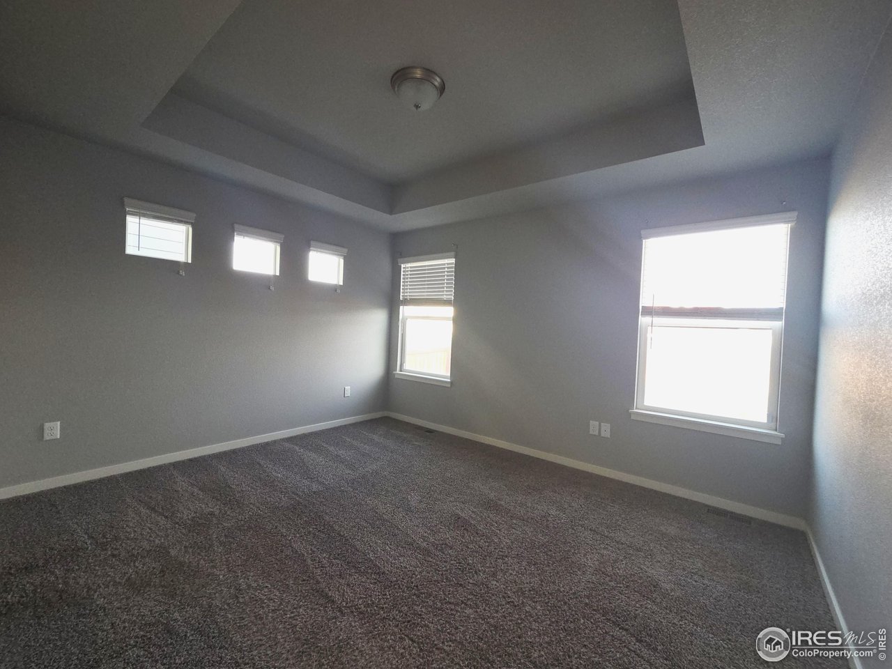 1203 Bison Way Wiggins, CO 80654 - Photo 6 of 17 an empty room that has a window