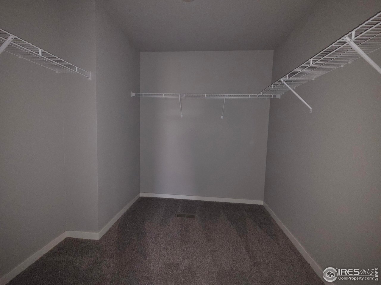 1203 Bison Way Wiggins, CO 80654 - Photo 9 of 17 a view of a room with racks on the wall