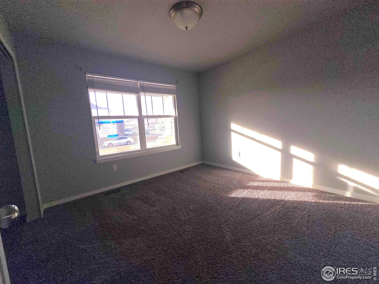 1203 Bison Way Wiggins, CO 80654 - Photo 10 of 17 a view of empty room with window
