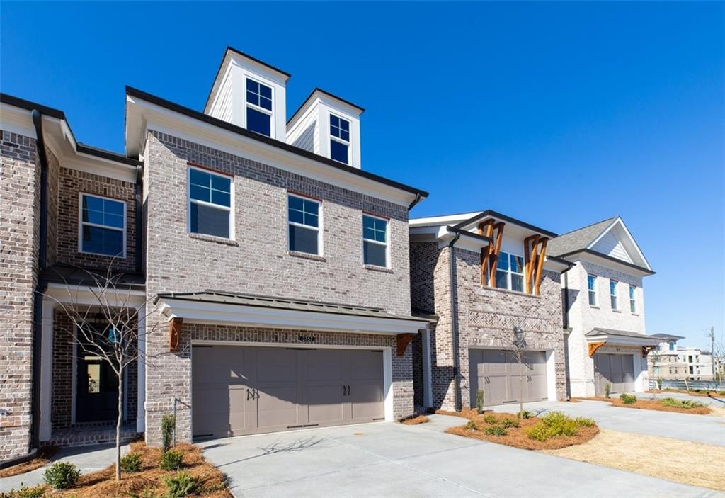 5117 Riden Way, Unit 280 Buford, GA 30518 - Photo 1 of 1 a front view of a house with yard