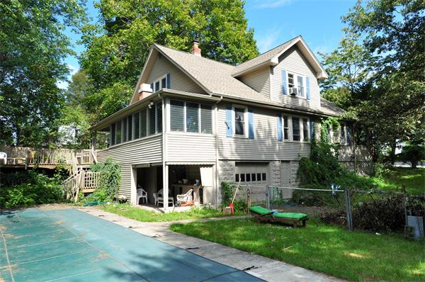 1 Payson Street Lexington, MA 02421 - Photo 1 of 14 a front view of a house with a yard table and chairs