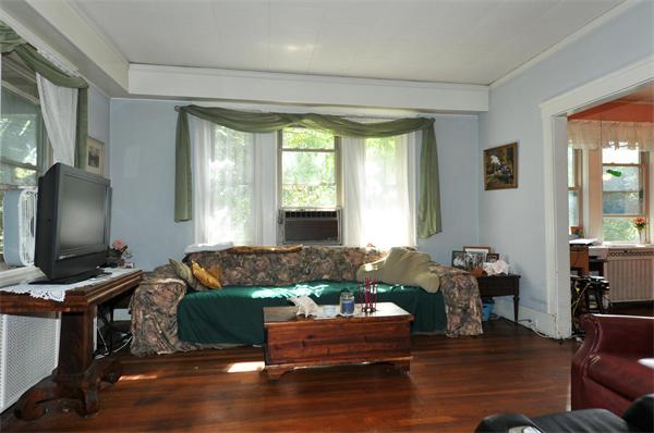 1 Payson Street Lexington, MA 02421 - Photo 3 of 14 a living room with furniture and a flat screen tv