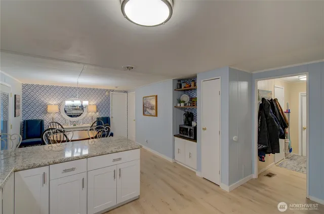a dining room with furniture and window