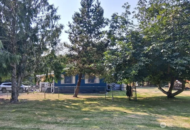 a house with trees in the background
