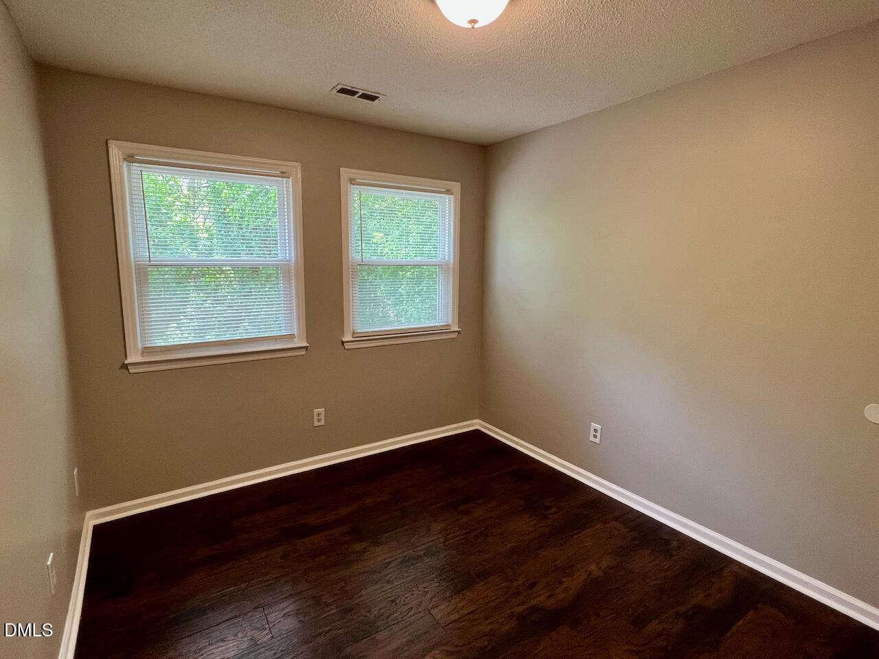 1320 Poole Road, Unit L Raleigh, NC 27610 - Photo 10 of 12 a view of a room with wooden floor and a window