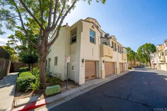 a house with a tree in front of it