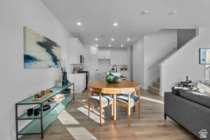 907 West Bright Ridge Ln Street, Unit 1430 St. George, UT 84790 - Photo 2 of 19 Open-concept main living area with wood-finish flooring, white walls, and recessed lighting