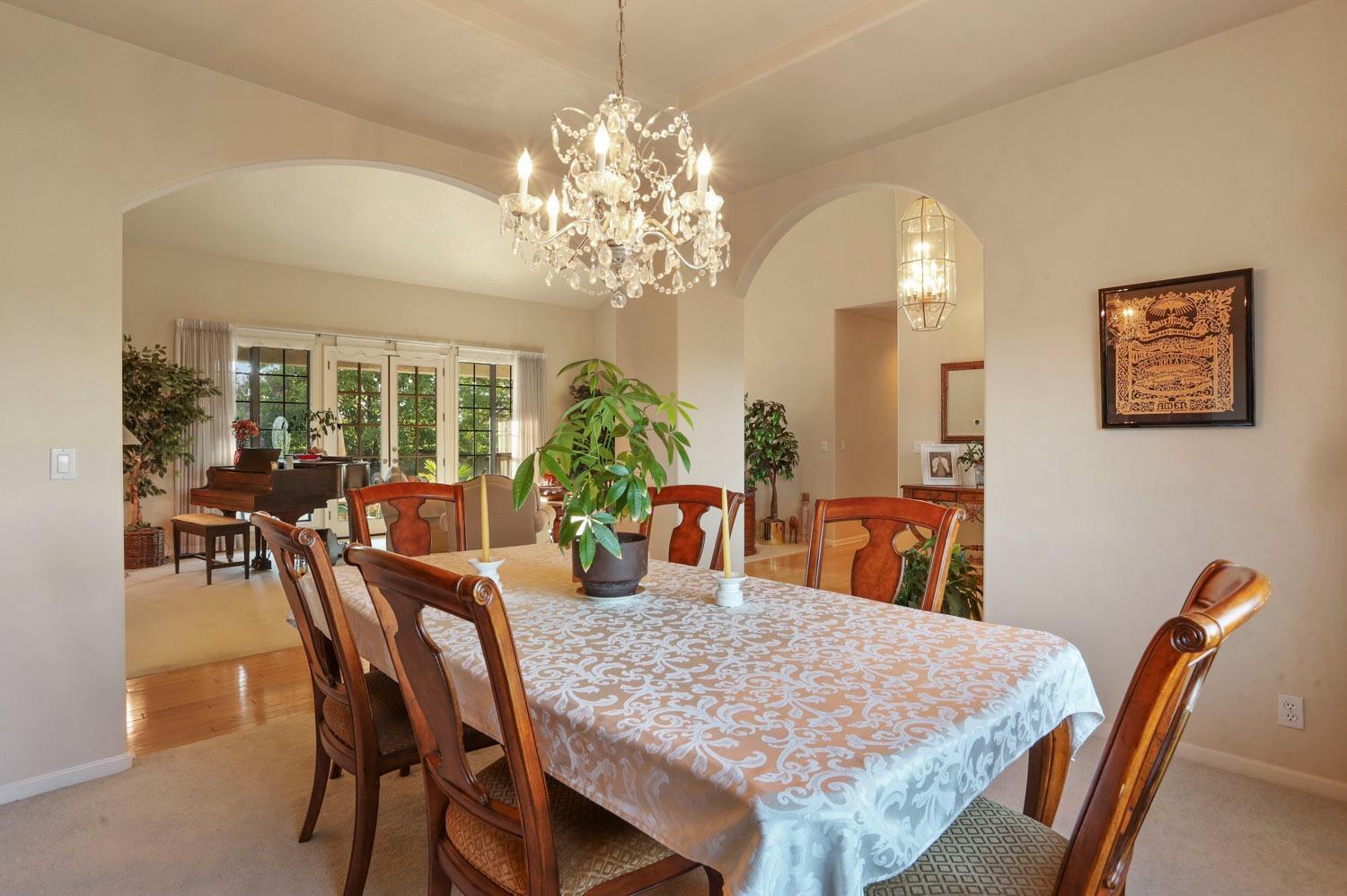 11791 Alpine Road Lodi, CA 95240 - Photo 16 of 74 a view of a dining room with furniture and chandelier