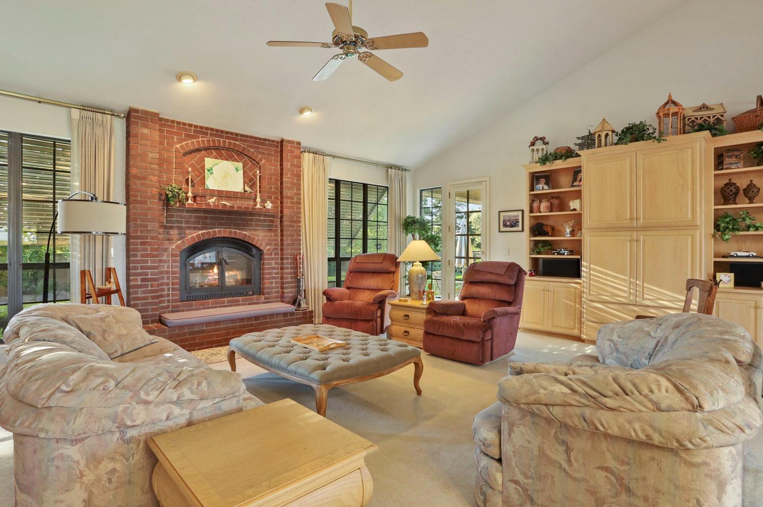 11791 Alpine Road Lodi, CA 95240 - Photo 19 of 74 a living room with furniture and a fireplace