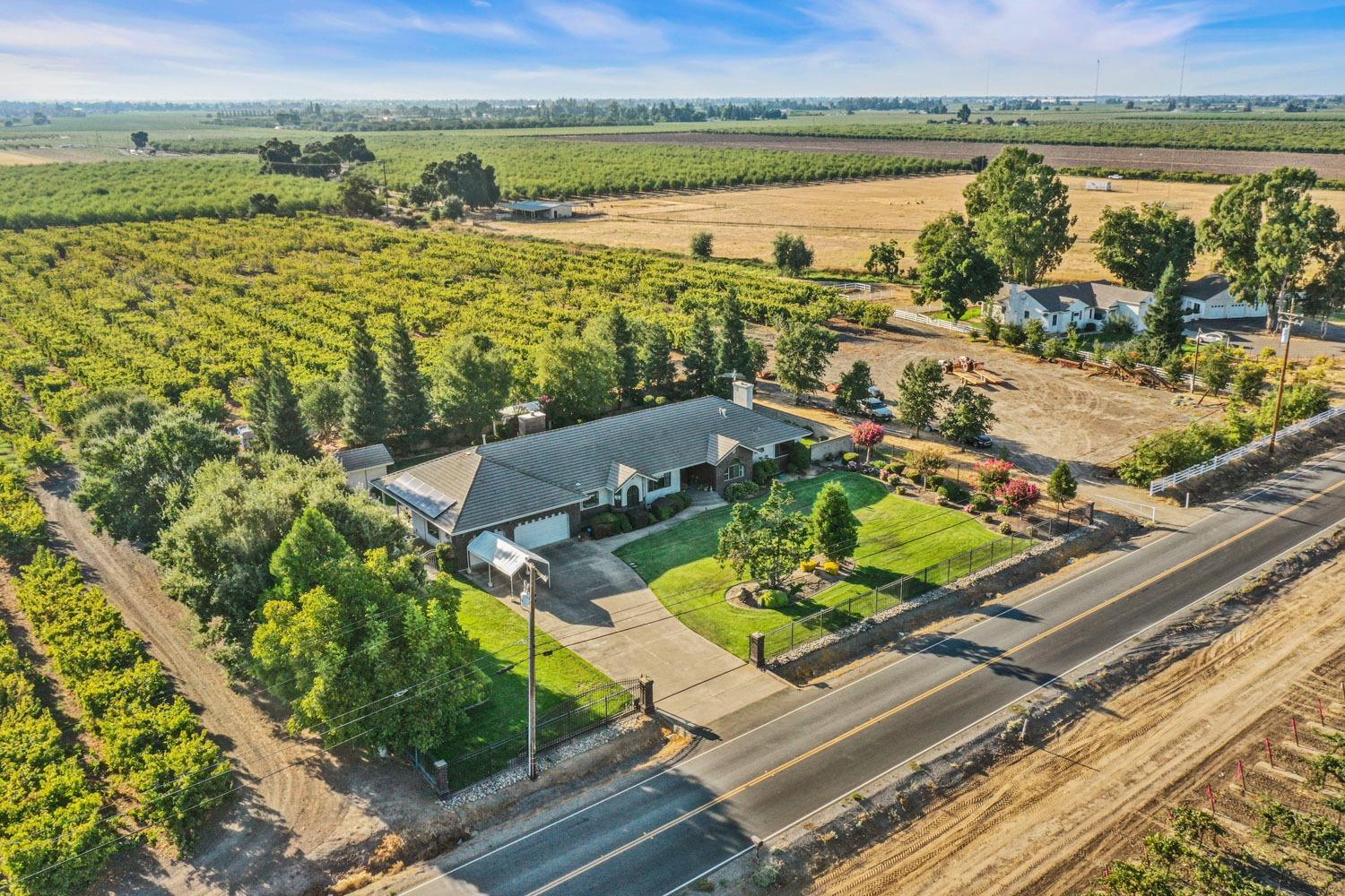 11791 Alpine Road Lodi, CA 95240 - Photo 2 of 74 an aerial view of a house with a lake view