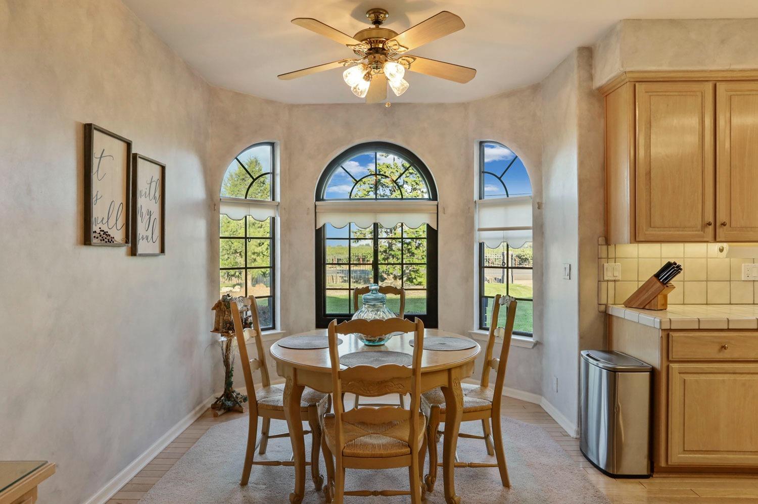 11791 Alpine Road Lodi, CA 95240 - Photo 24 of 74 a dining room with furniture and window