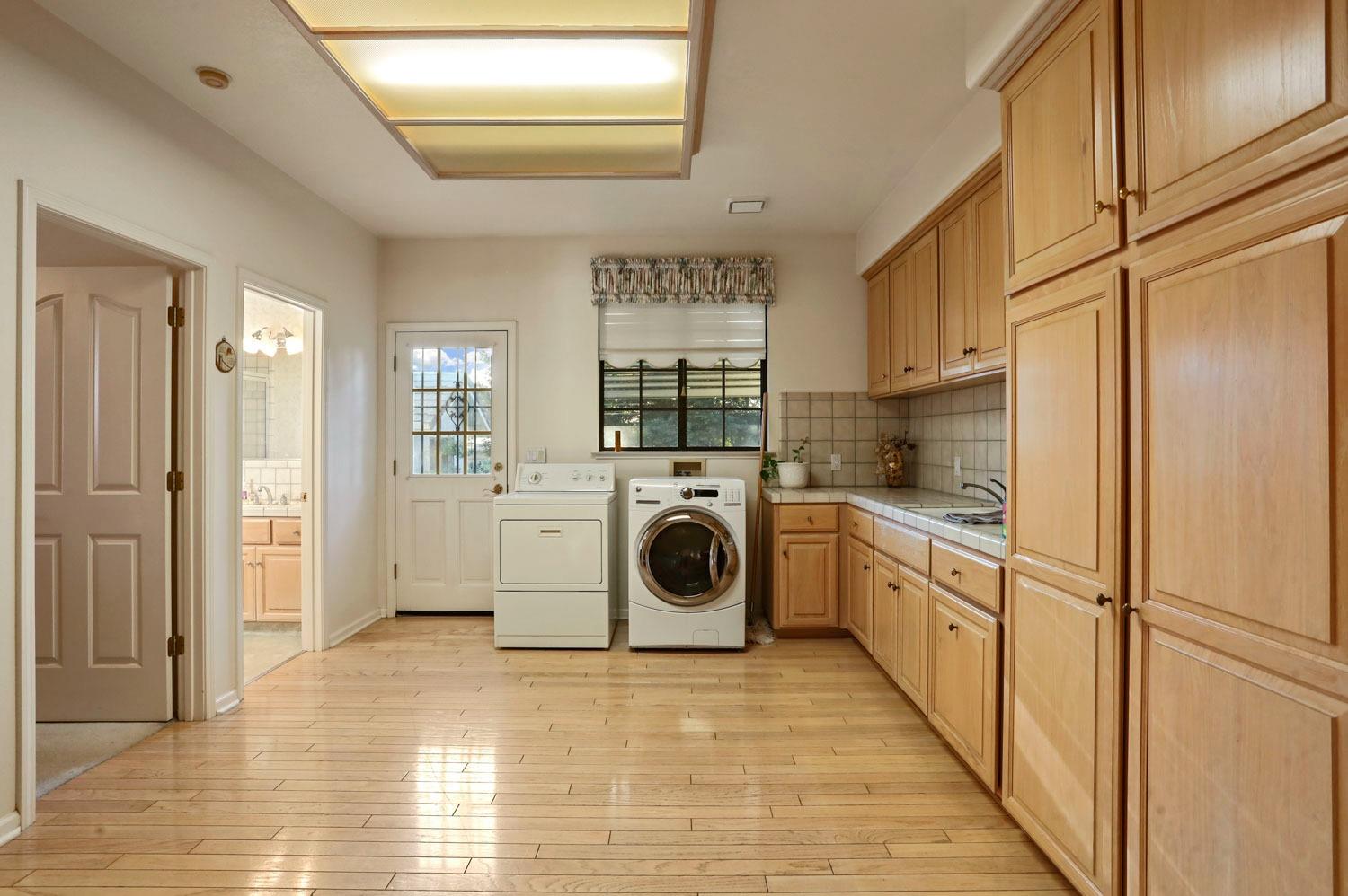 11791 Alpine Road Lodi, CA 95240 - Photo 30 of 74 a view of a kitchen with washer and dryer