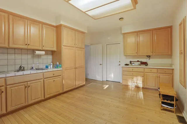 a spacious bedroom with a bed and a window