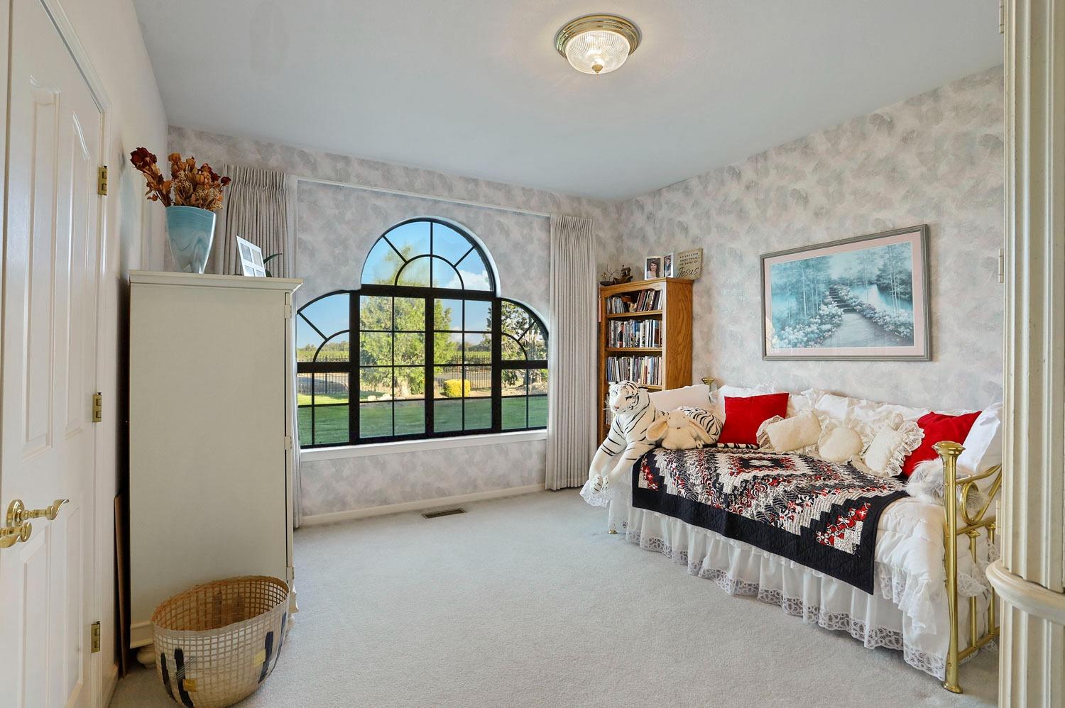 11791 Alpine Road Lodi, CA 95240 - Photo 38 of 74 a living room with furniture and a gate