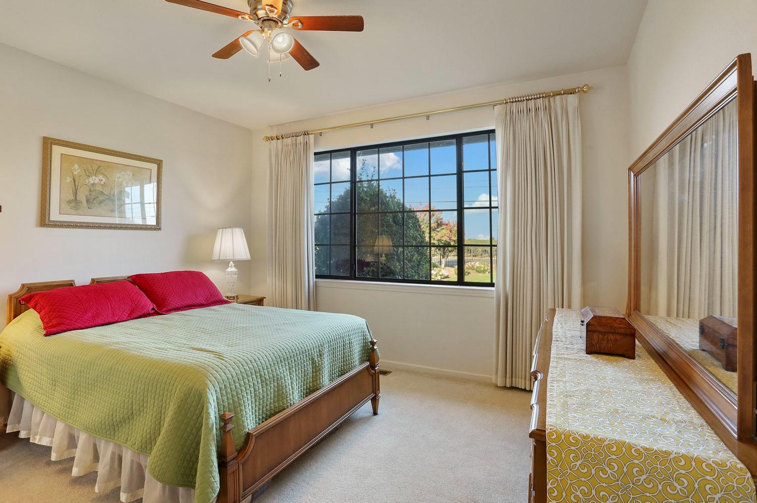 11791 Alpine Road Lodi, CA 95240 - Photo 41 of 74 a bedroom with a bed and a window