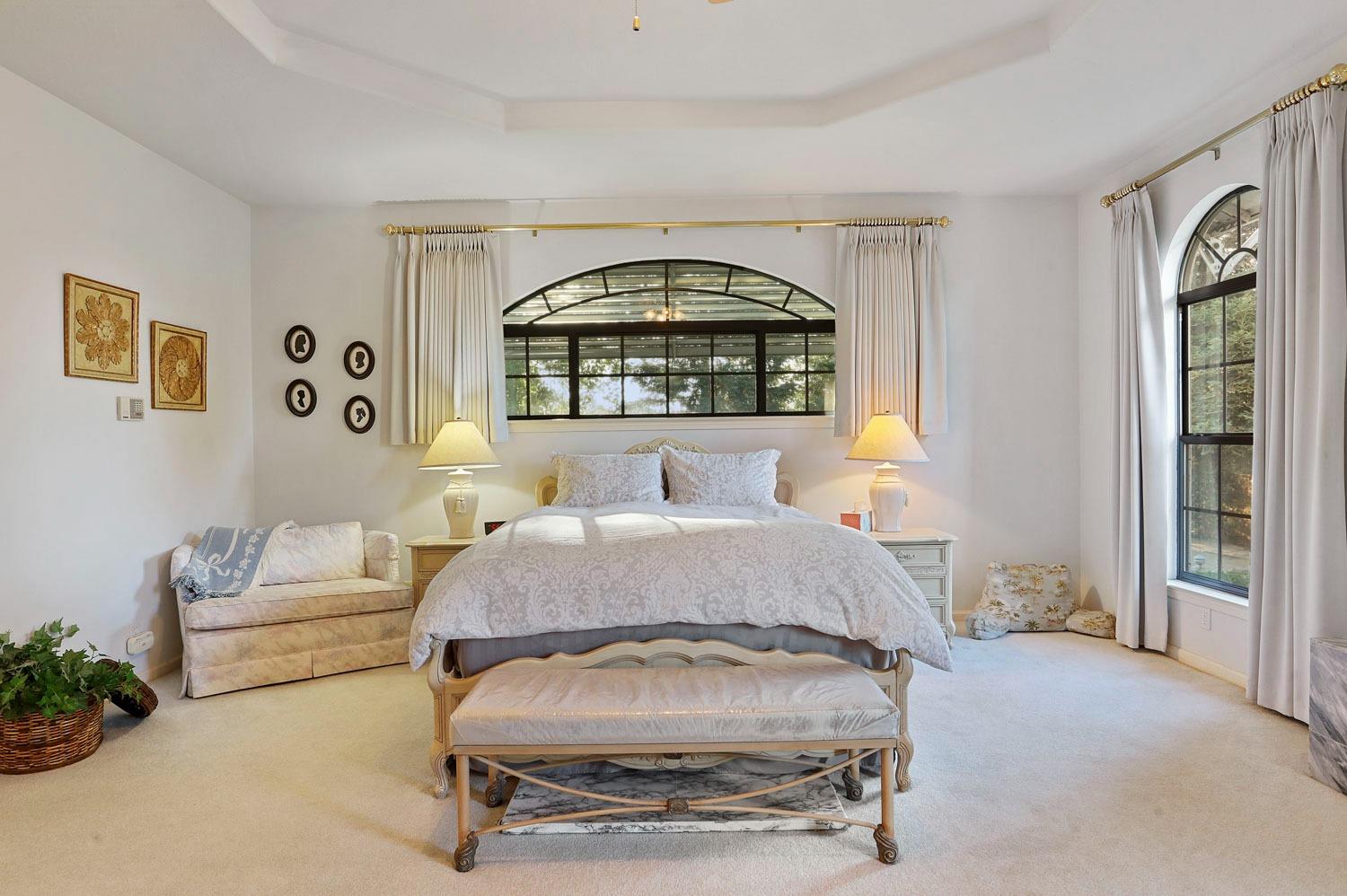 11791 Alpine Road Lodi, CA 95240 - Photo 44 of 74 a spacious bedroom with a bed and a window