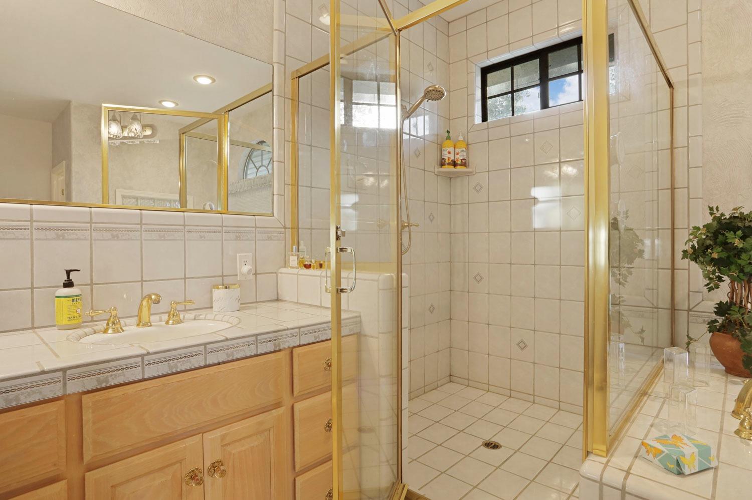 11791 Alpine Road Lodi, CA 95240 - Photo 50 of 74 a bathroom with a sink and a mirror