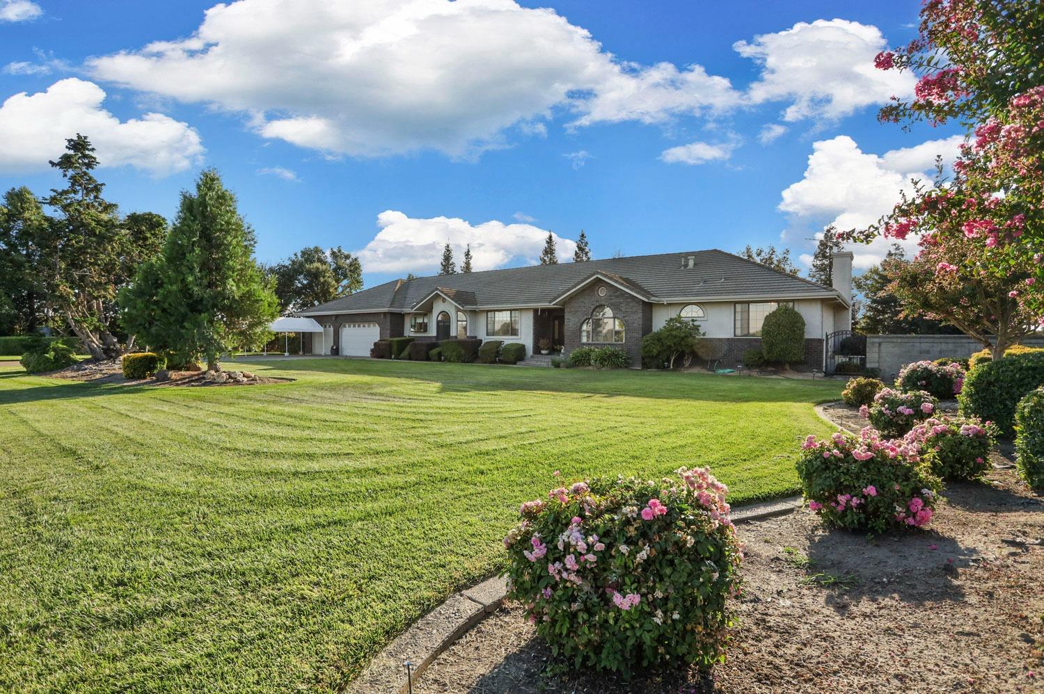 11791 Alpine Road Lodi, CA 95240 - Photo 6 of 74 a view of a house with a big yard