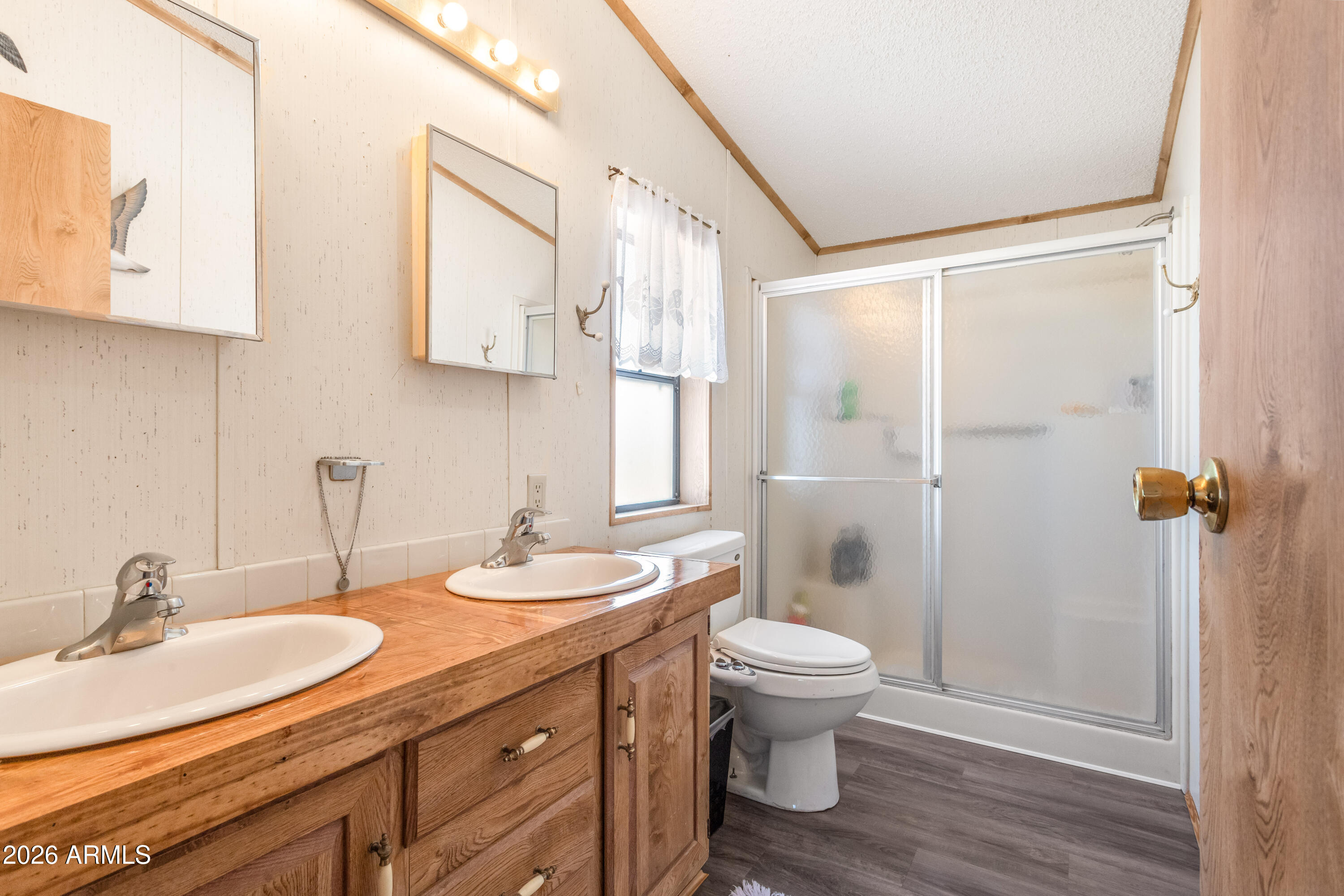 1935 North Tortoise Trail Dragoon, AZ 85609 - Photo 16 of 38 a bathroom with a double vanity sink toilet and shower