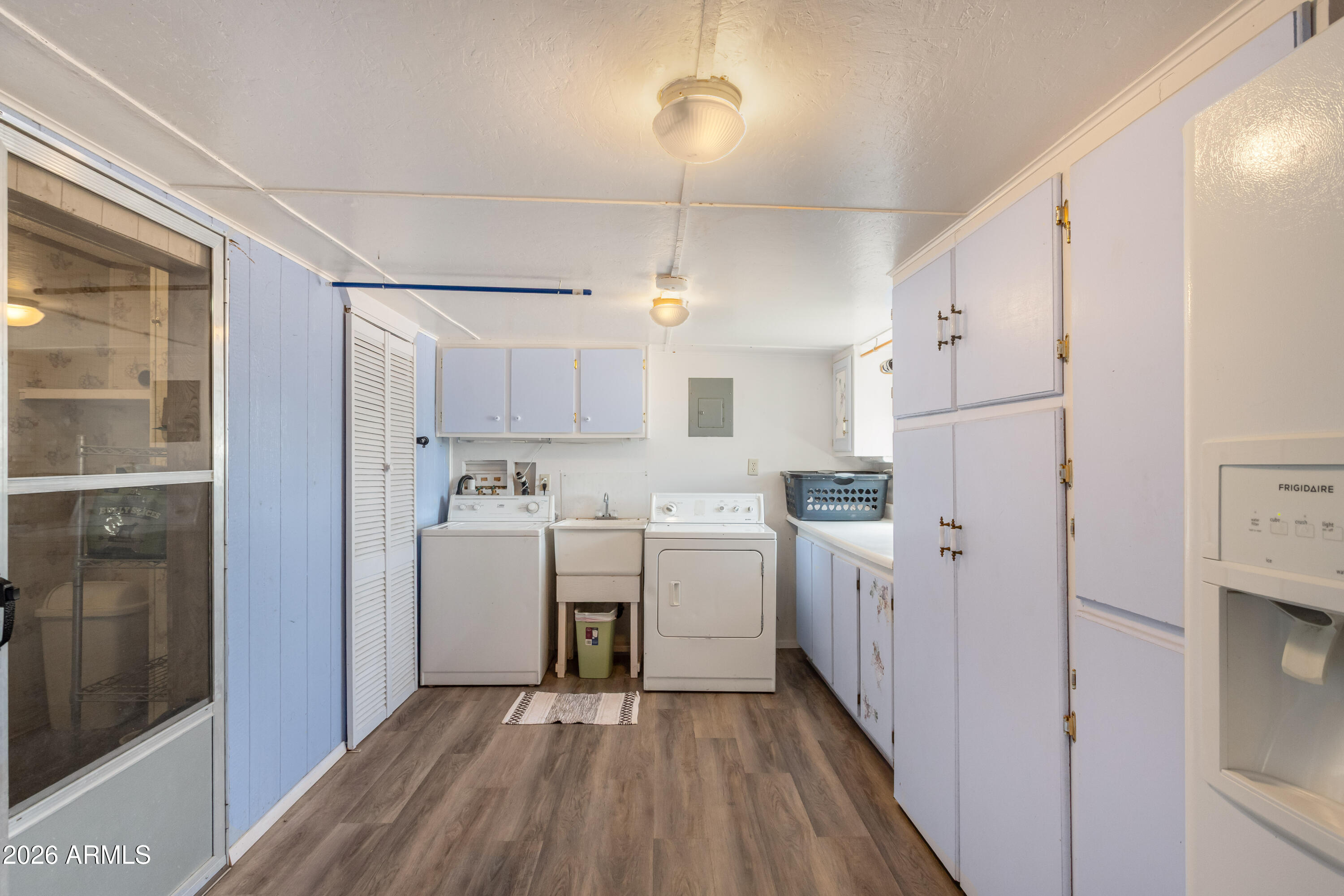 1935 North Tortoise Trail Dragoon, AZ 85609 - Photo 17 of 38 a kitchen with white cabinets and white appliances