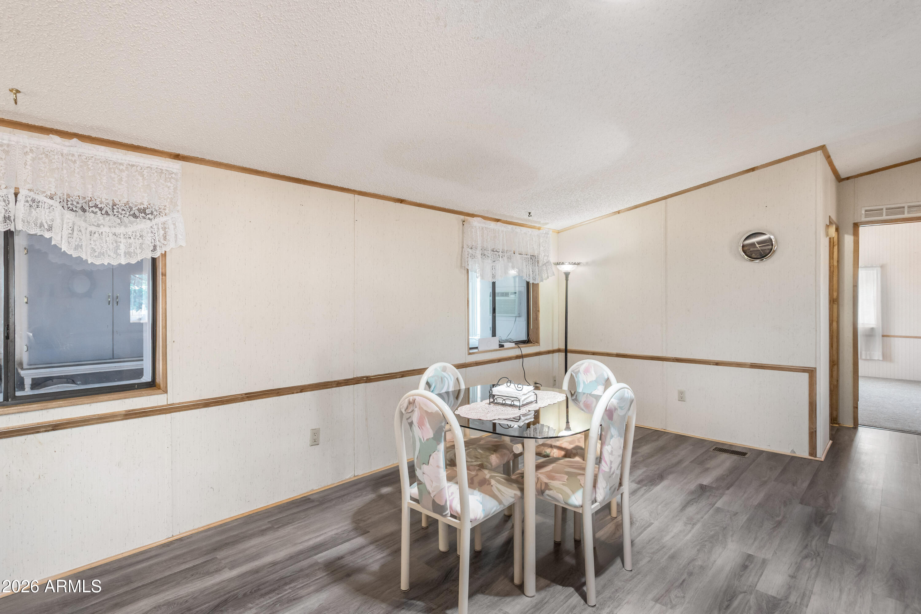 1935 North Tortoise Trail Dragoon, AZ 85609 - Photo 7 of 38 a view of a dining room with furniture and wooden floor
