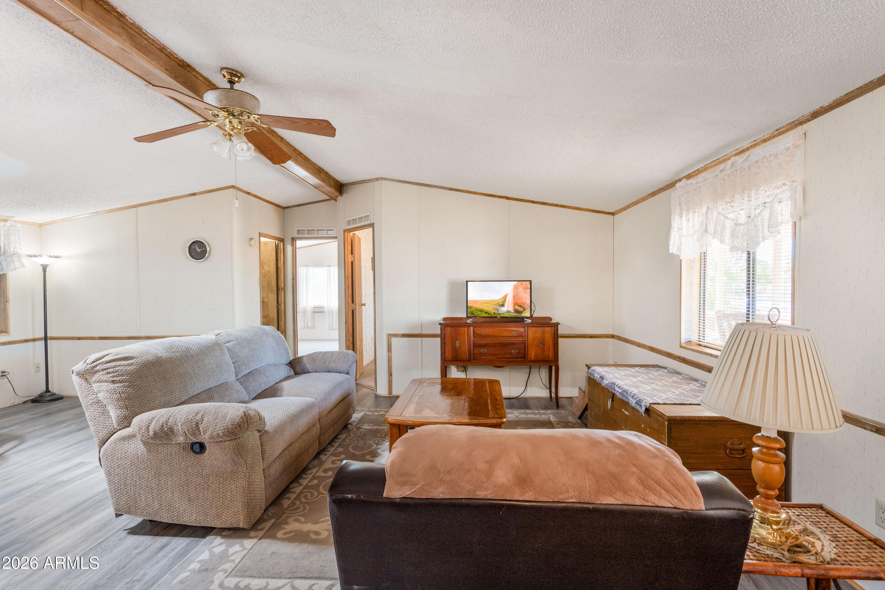 1935 North Tortoise Trail Dragoon, AZ 85609 - Photo 9 of 38 a living room with furniture and a flat screen tv