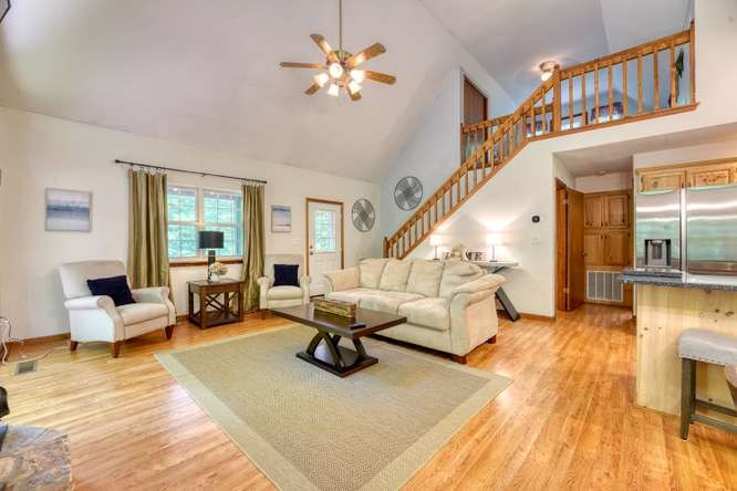 3333 Ellington Road Hayesville, NC 28904 - Photo 31 of 56 a living room with furniture and a chandelier