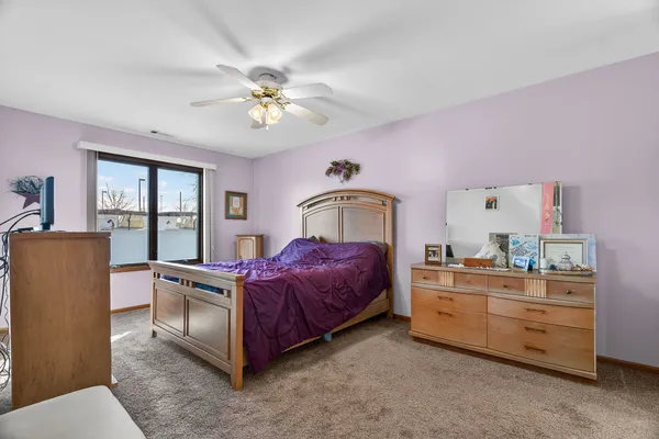 a bed room with a bed and a chandelier