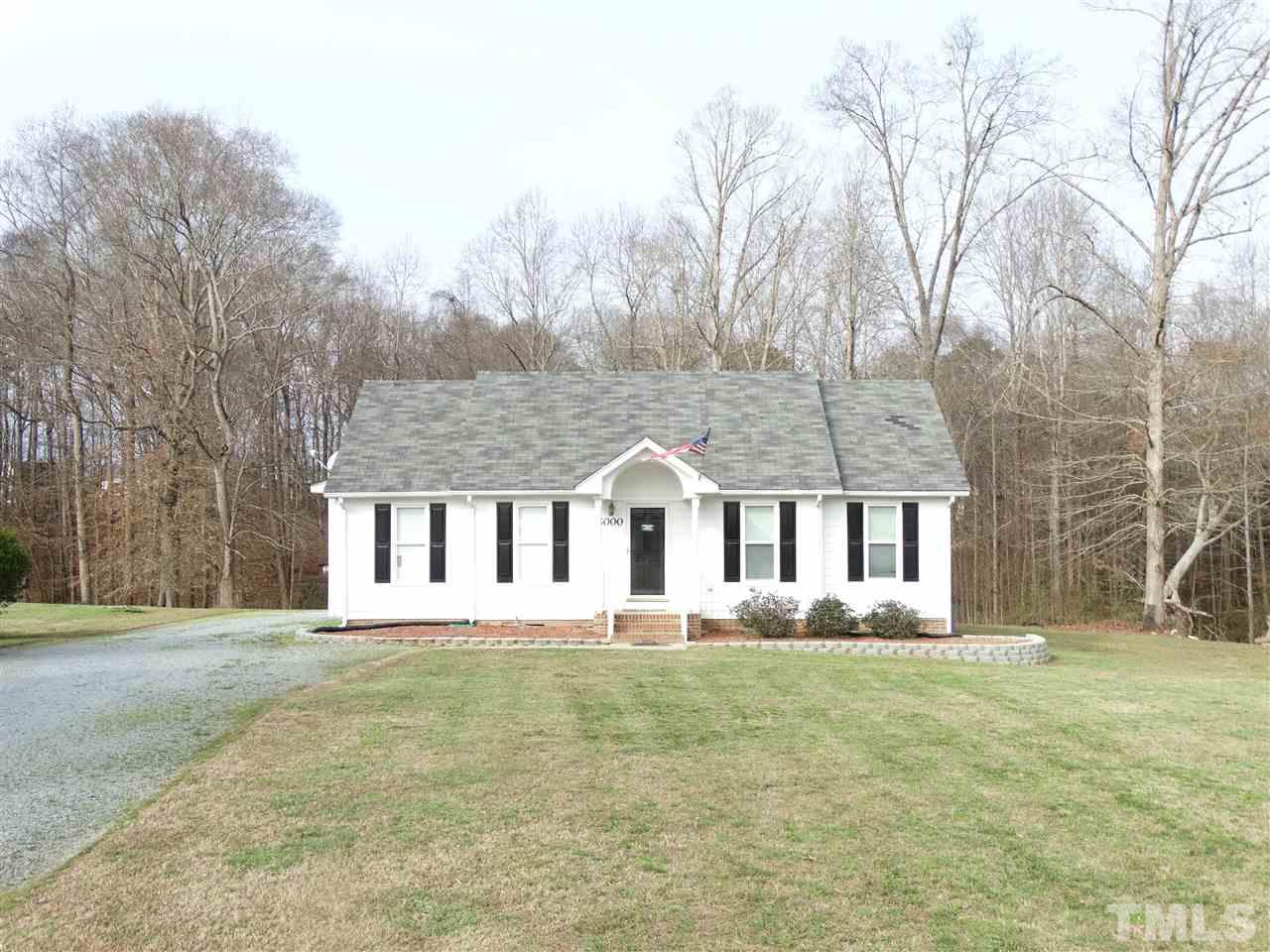 5000 Raleigh Road Benson, NC 27504 - Photo 2 of 25 front view of a house with a yard