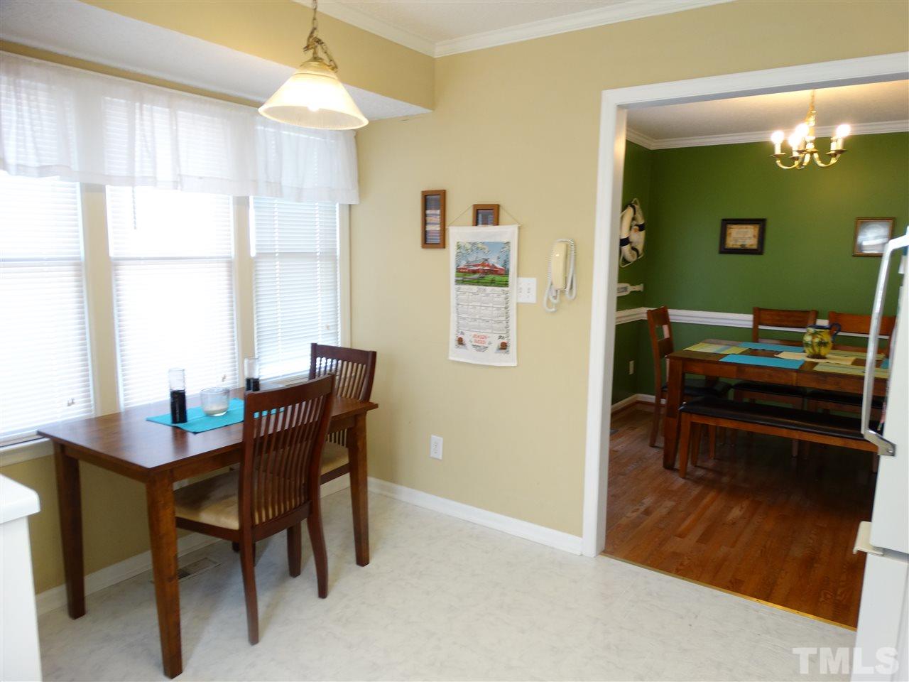 5000 Raleigh Road Benson, NC 27504 - Photo 12 of 25 a dining room with furniture and a window