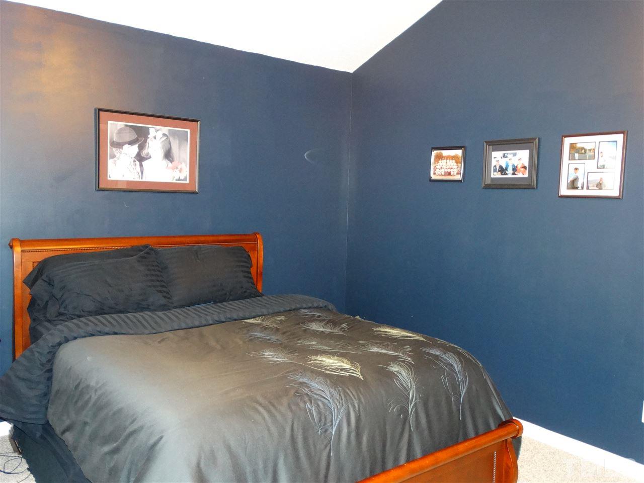 5000 Raleigh Road Benson, NC 27504 - Photo 14 of 25 a bedroom with a bed and window