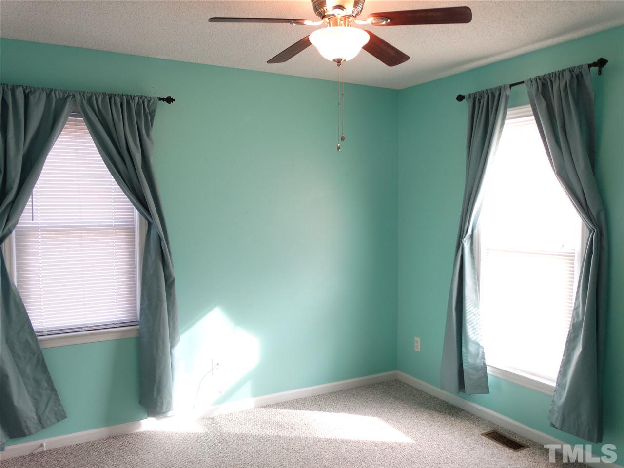 5000 Raleigh Road Benson, NC 27504 - Photo 18 of 25 a view of a room with a large window and chandelier